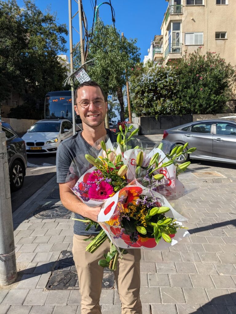 JLIC community member delivering rescued flowers