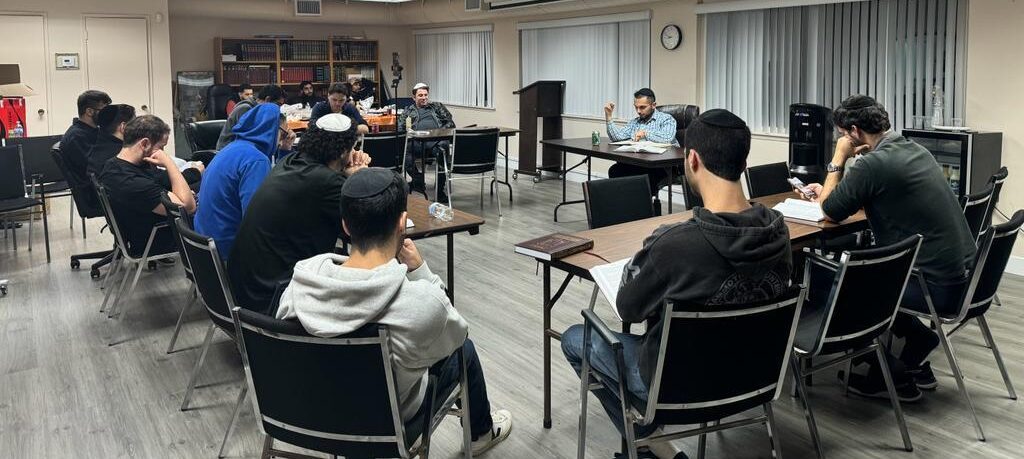 A group of the JLIC West Coast Talmud Group learning together at their weekly gathering. 