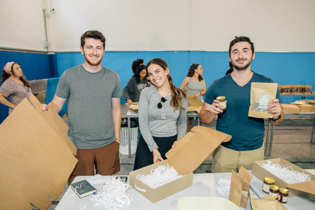 JLIC Yavneh and JNF Israel Experience students packing boxes for the IDF.