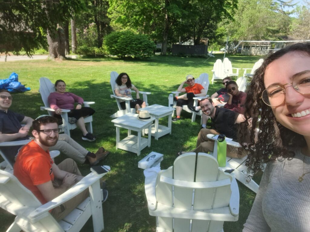 JLIC students on the Chasidic Retreat Liba Ba'ey enjoying a discussion on the camp grounds. 