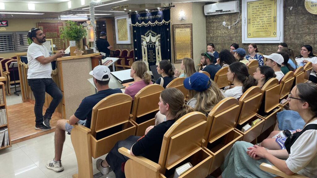 The Summer Mission group listening to a presentation 