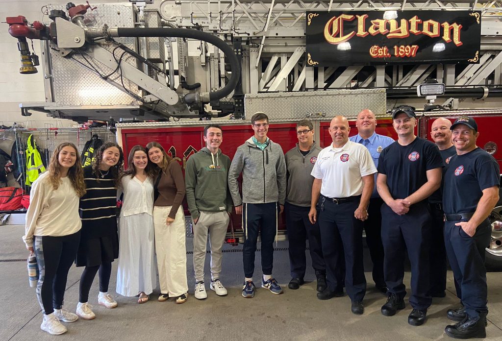 JLIC students visit the Clayton MO fire department on 9/11 to show appreciation for their service.