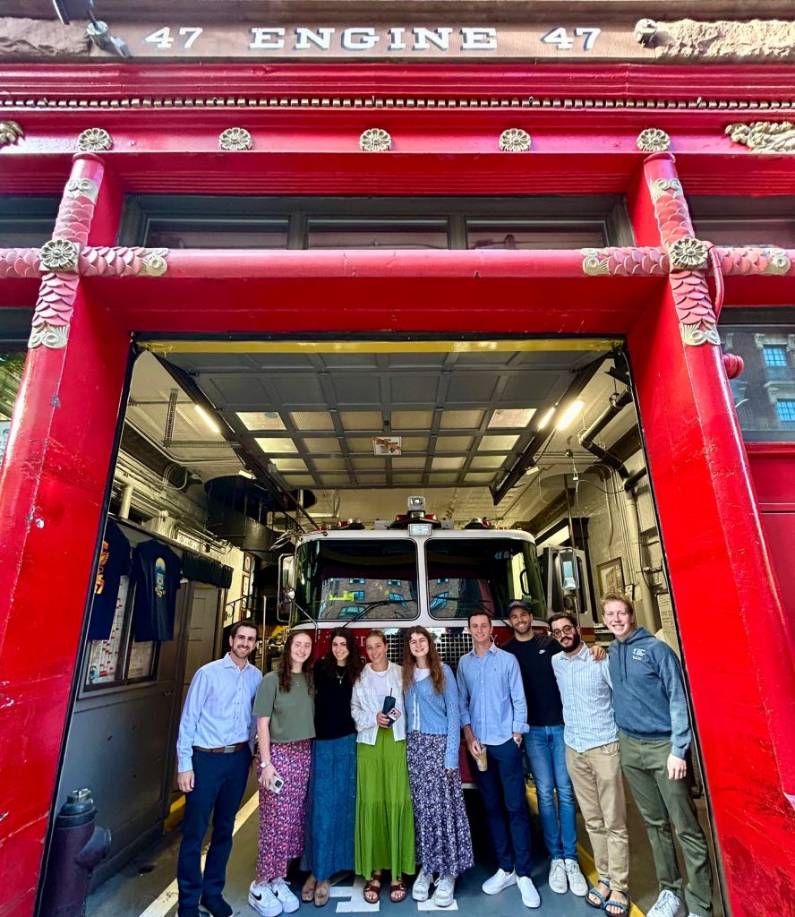 JLIC students visit a NYC fire department on 9/11 to show appreciation for their service.