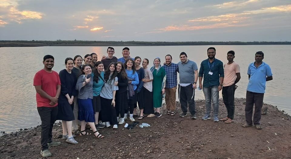 The JLIC Rutgers group standing by a lake in India 