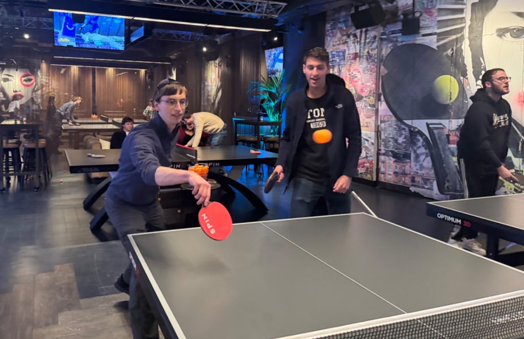 Yavneh LEAD Fellows in an intense game of ping-pong