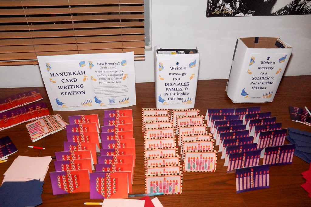 Card writing station at the JLIC Tel Aviv annual Chanukah party.