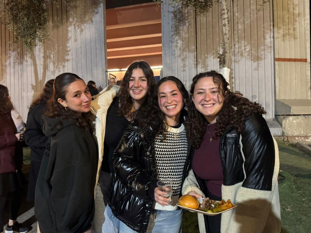 Yavneh Fellows having fun at dinner during their Alternative Winter Break Trip