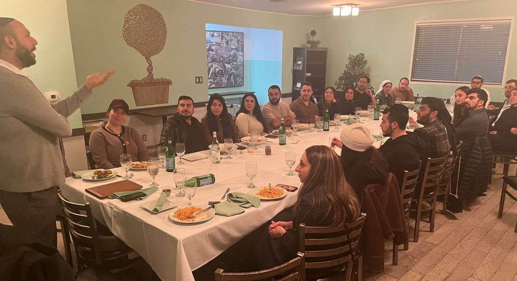 The attendees at the Shalom Bayit Workshop listen to Elan Javanfard, LMFT