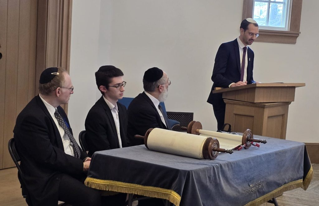 Rav Azi speaking at the torah dedication