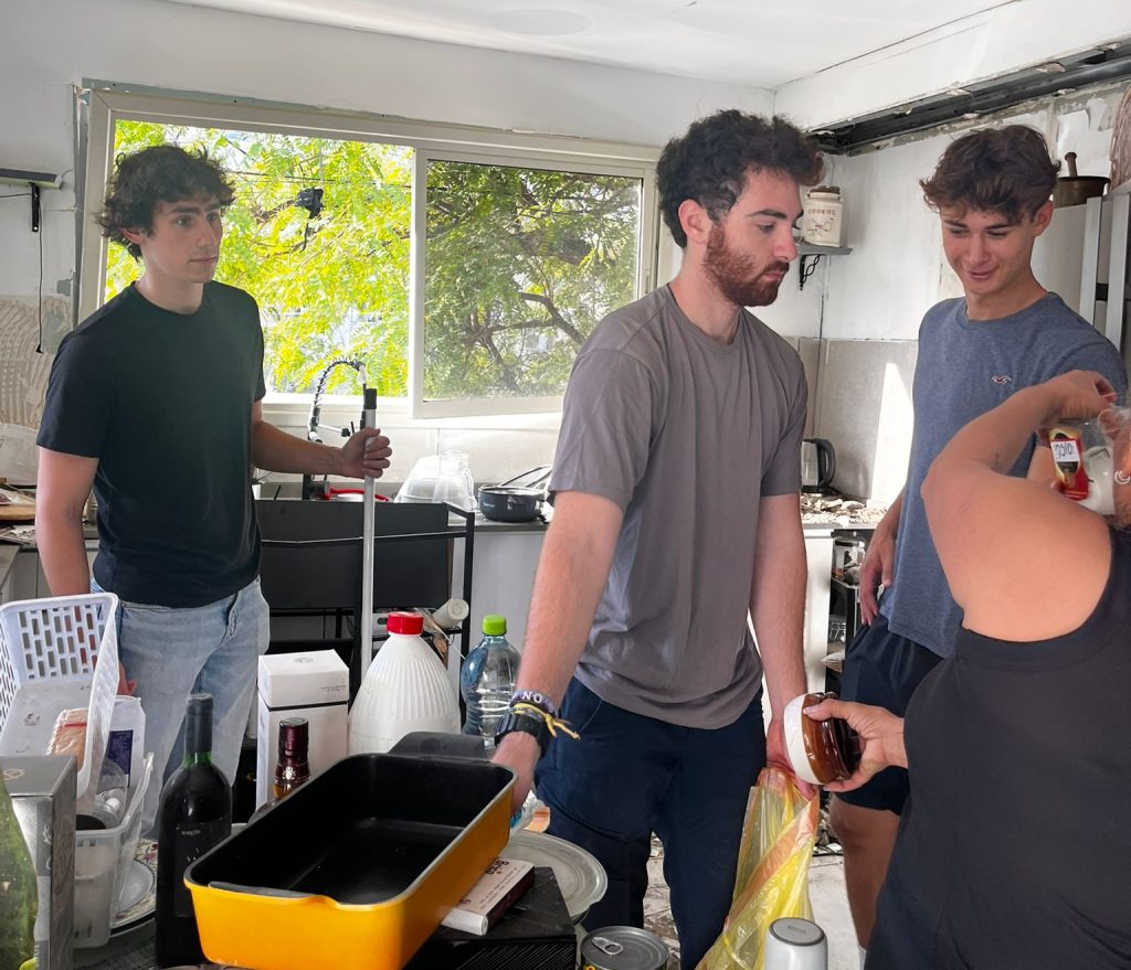 JLIC members helping clear out a home that was damaged by Iran rocket fire