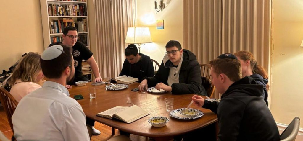 JLIC Michigan Students learning and enjoining dinner at the Lorkis' home