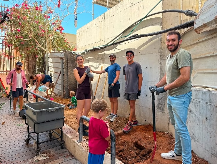 A group of JLIC TLV volunteers finished the base of a new vegetable garden at a homeless shelter.